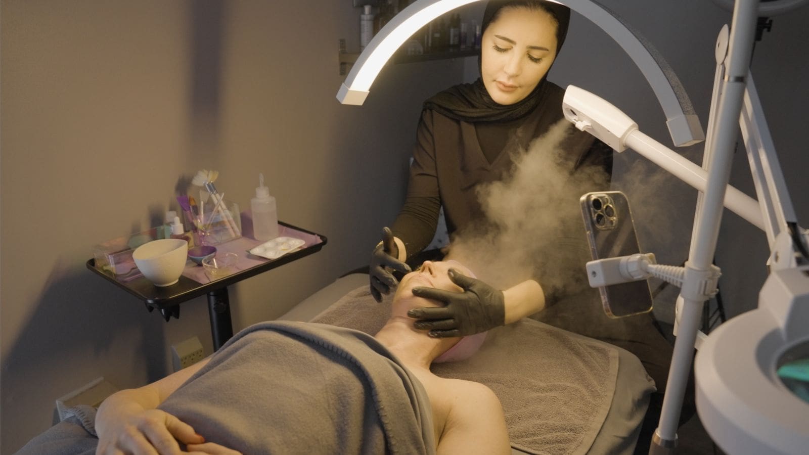 Students providing services to real clients in the Altruistic Beauty Academy student spa
